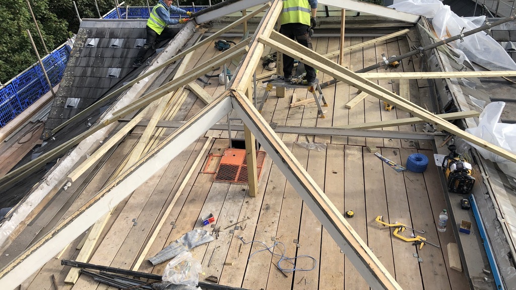 PHD surveyors inspecting roof timbers on site